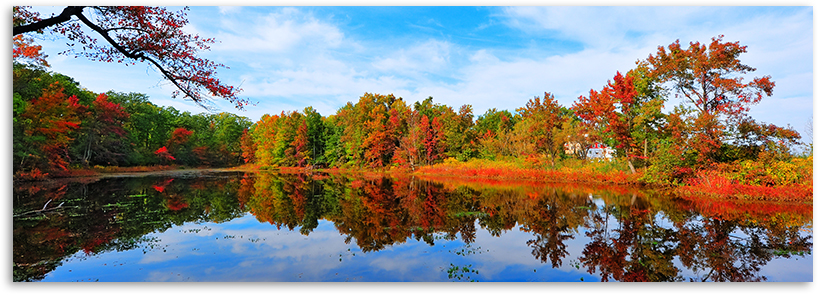The beautiful colors of fall reflected in a lake. 