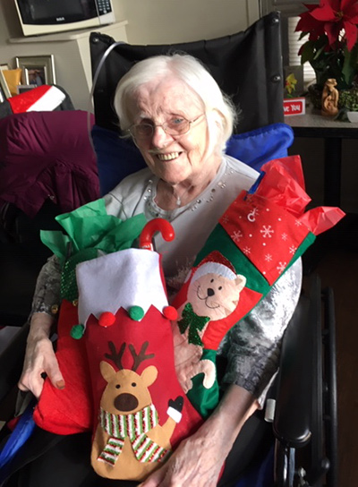 Sr. Mary Caulfield with stocking for the Sisters. 